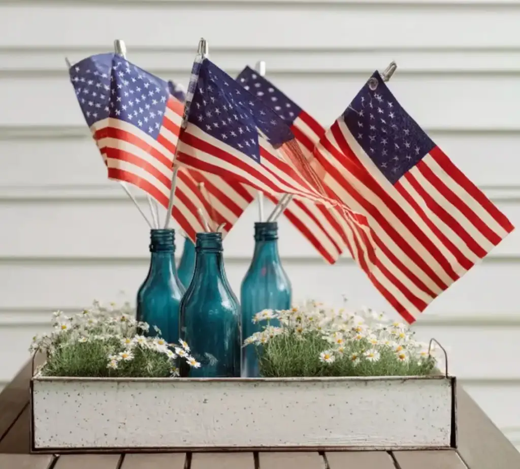 5 Memorial Day Party Decor Ideas for a Patriotic Summer Vibe 3. Create DIY Flag Bottle Displays