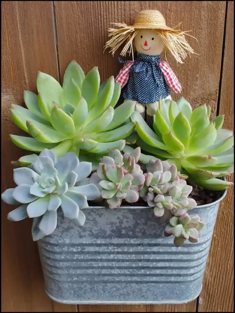 10 Repurposed Projects for a Whimsical Fall Garden 3. Scarecrow in Chicken Feeder Planter