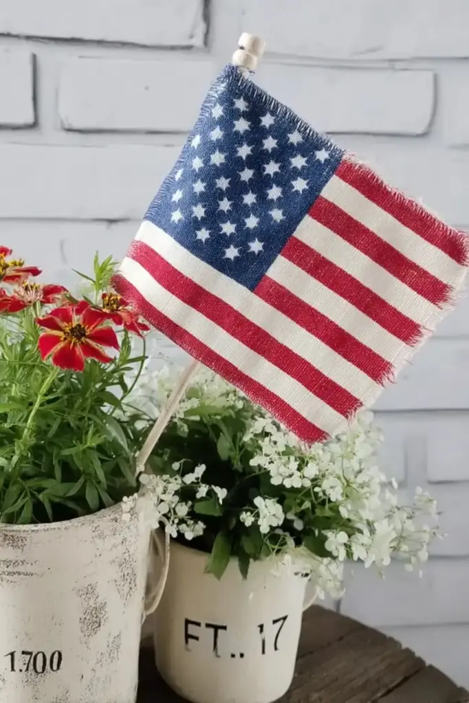 5 Memorial Day Party Decor Ideas for a Patriotic Summer Vibe 9. Add Mini Flags to Planters